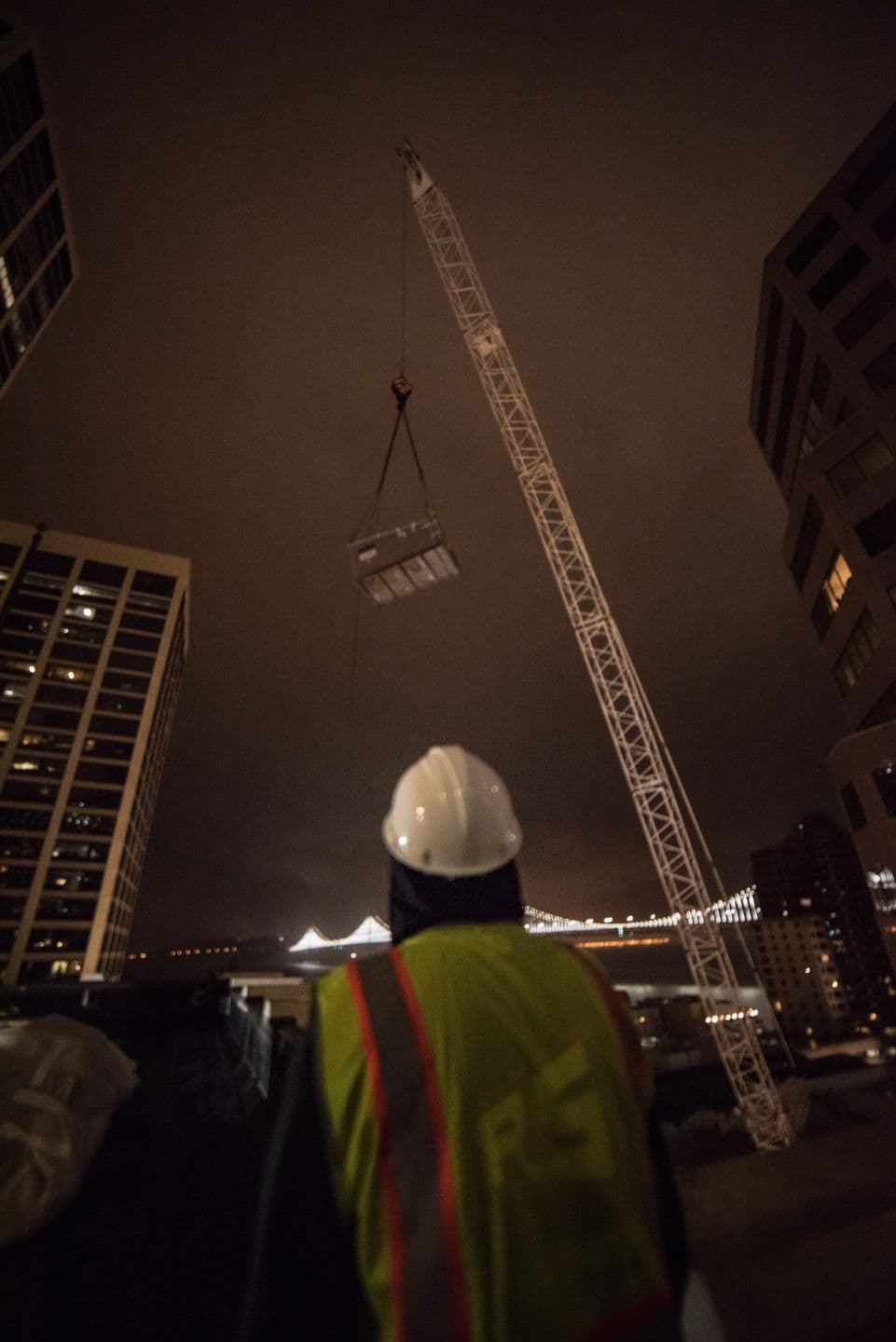 City Mechanical technician performing scheduled maintenance on commercial HVAC equipment